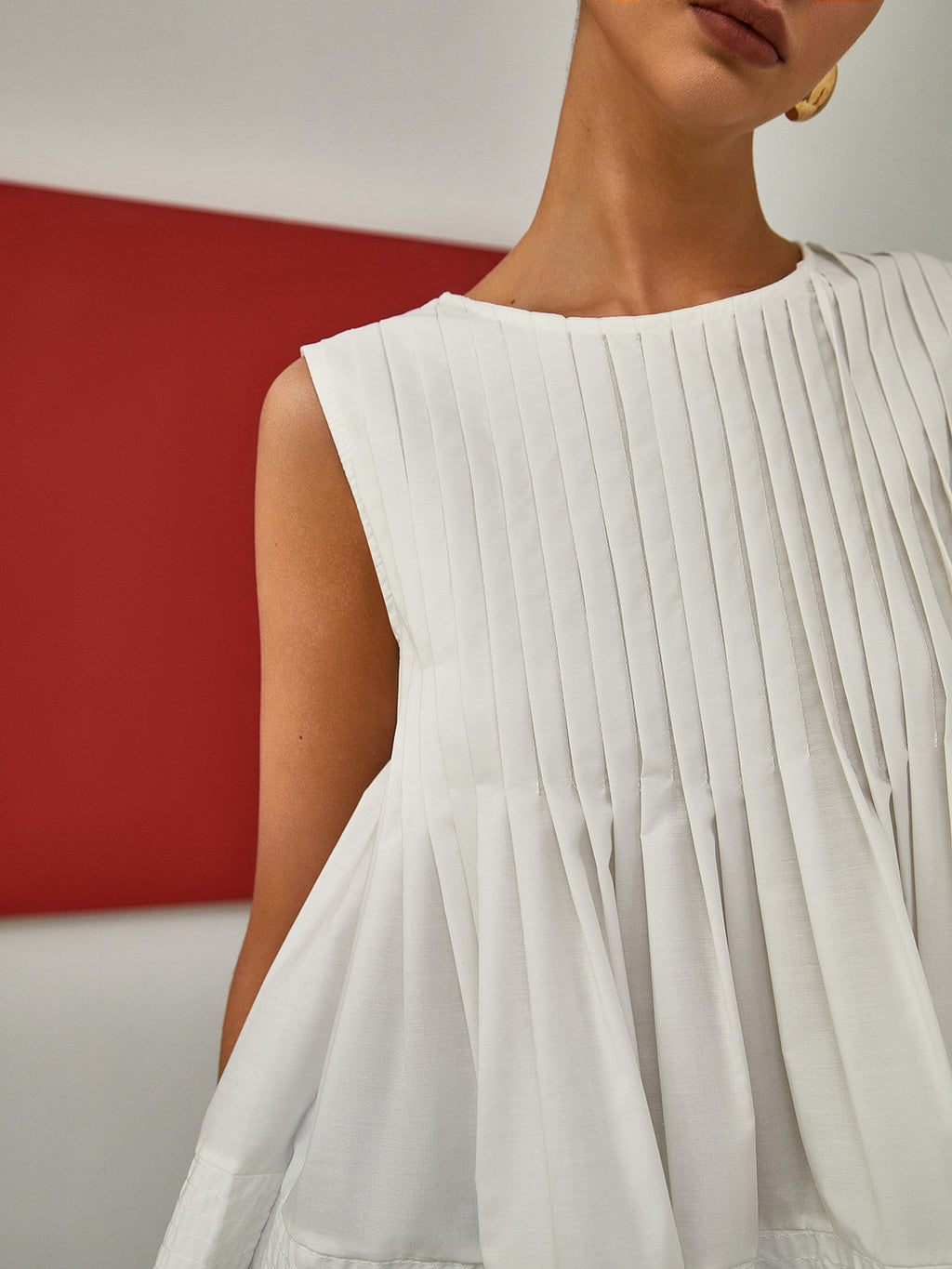 Petal Pleated Peplum Sleeveless Blouse