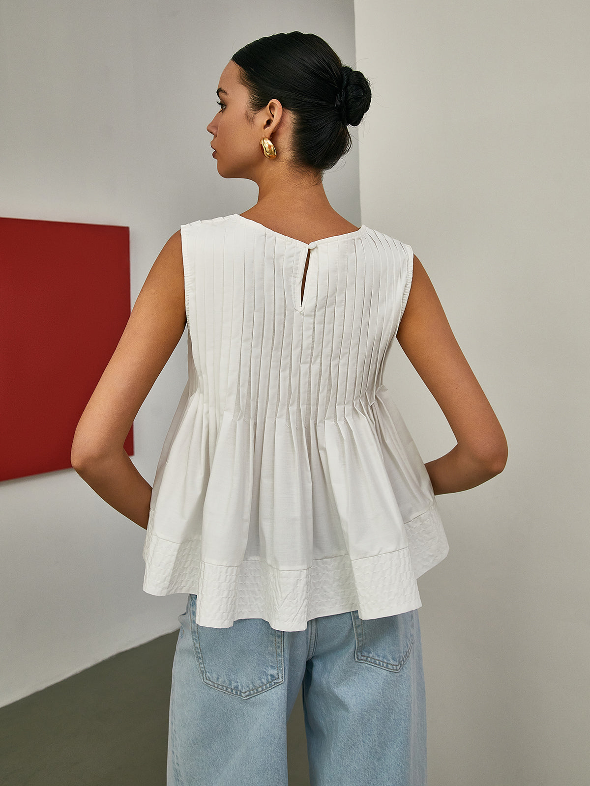 Petal Pleated Peplum Sleeveless Blouse