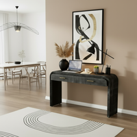 Black console table styled as work desk