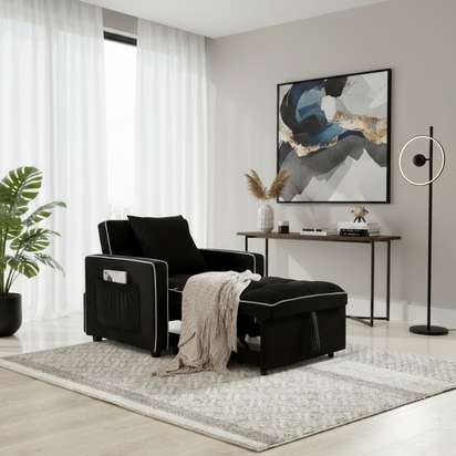 Black sleeper chair with blanket and matching background a