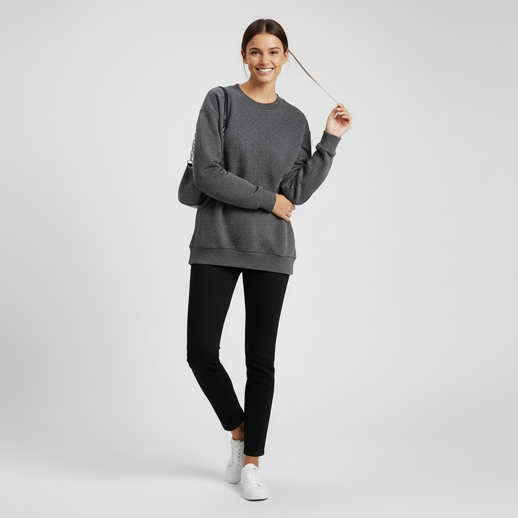 Playful sweatshirt hair-touch pose