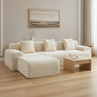 Scandinavian luxury living room with cream corduroy sofa - corner angle