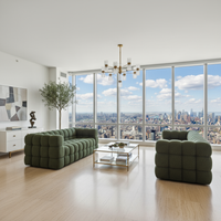 Two Green Sofas Facing Each Other