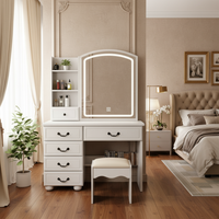 Vanity table next to bed with solid walls